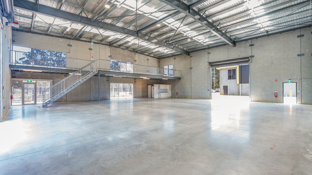 E-Hub Estate, Raceview — warehouse interior with mezzanine stair