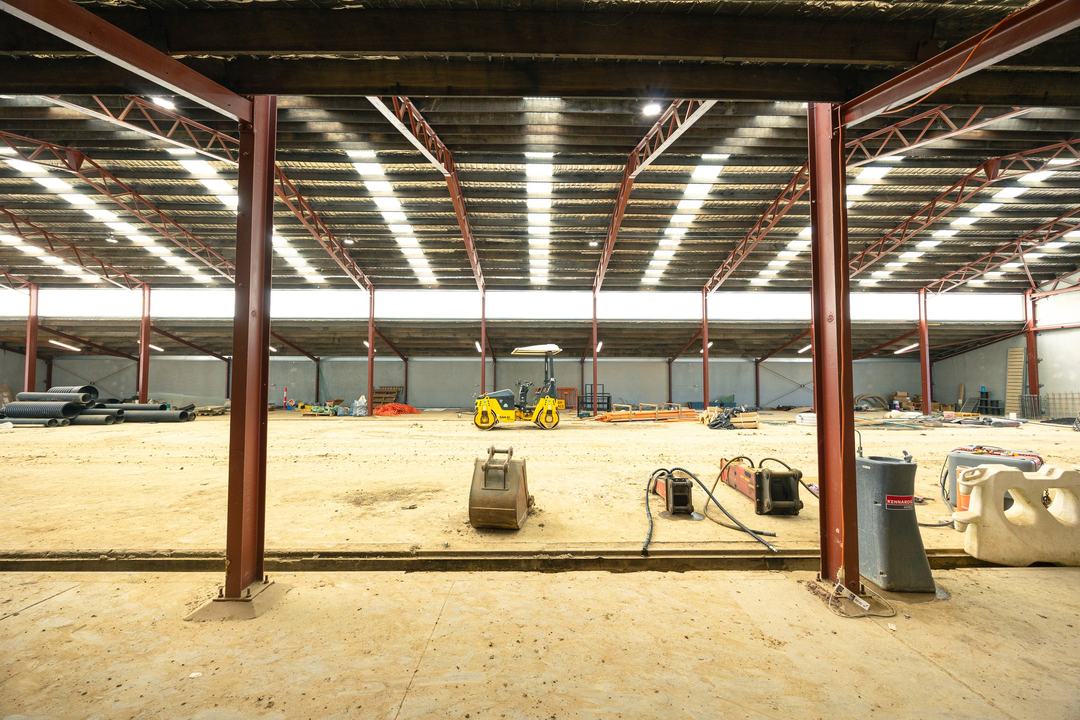 E-Hub Estate, Raceview — the steel portal frame up over the bare slab